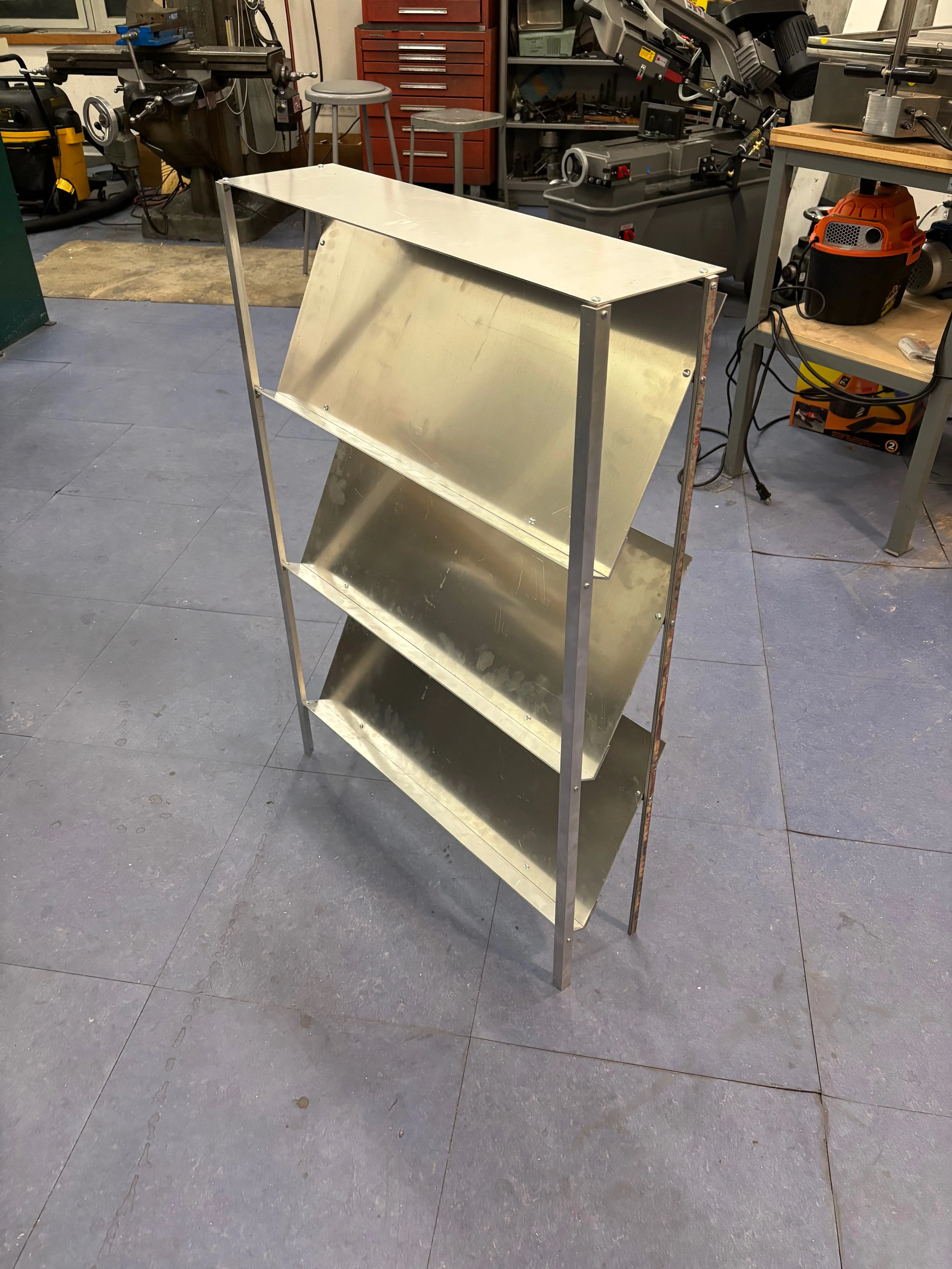 View from the front right of the fully assembled shoe rack, freestanding on the floor