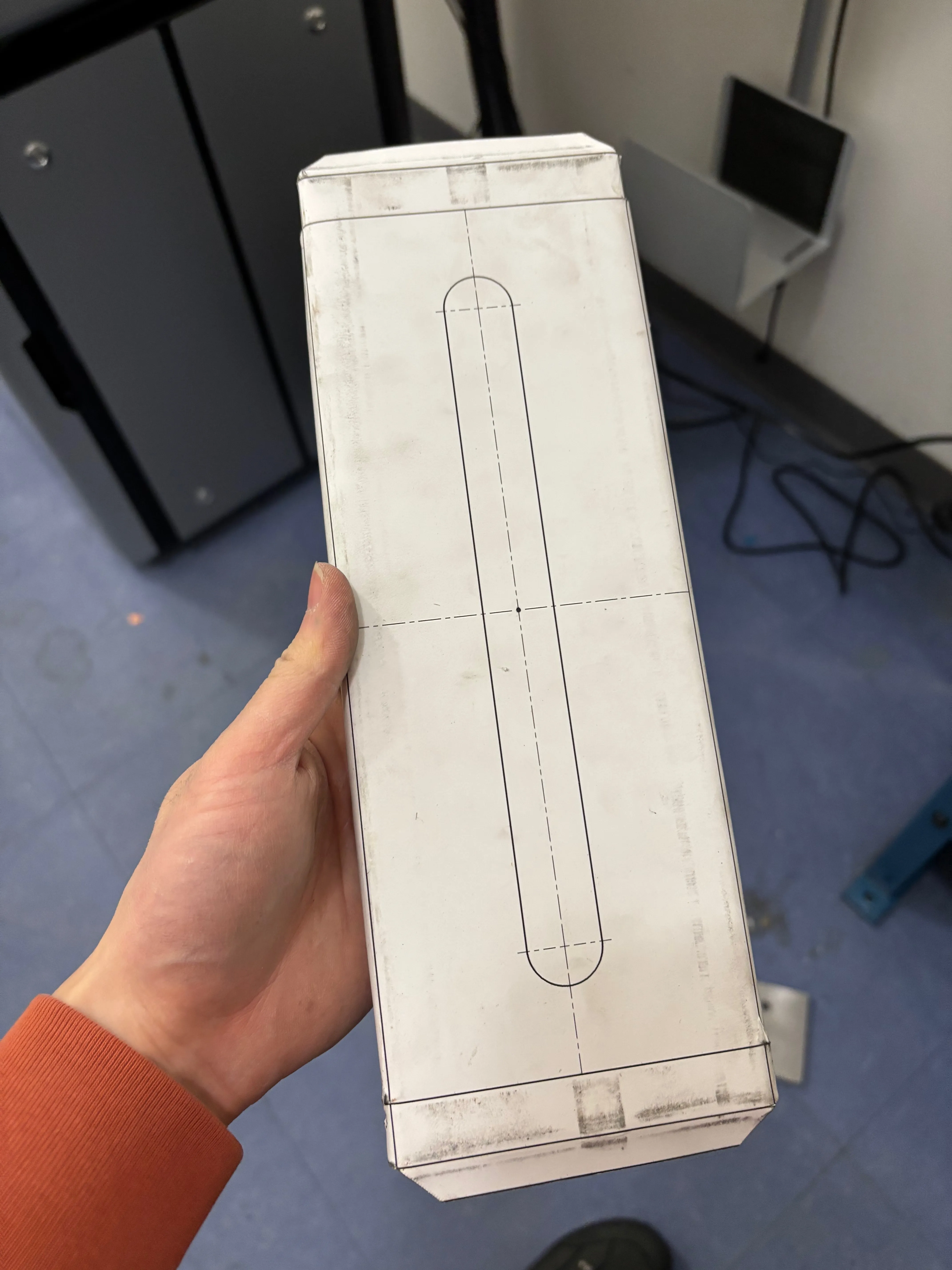 Front of partially folded sheet metal with paper template